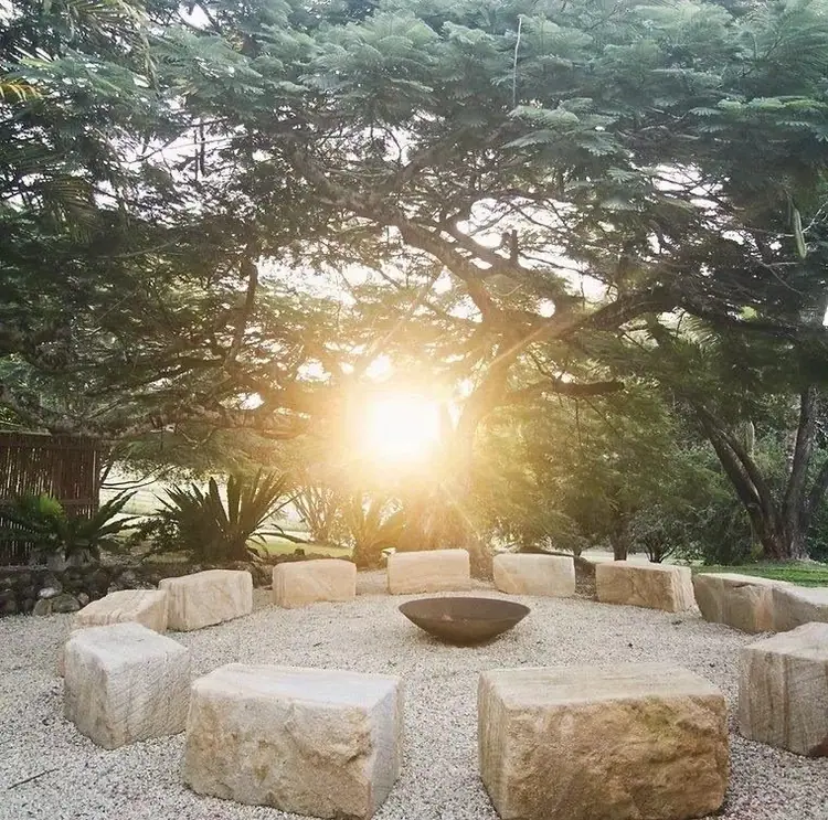 Stone seats around a fire pit in the hinterland at sunrise